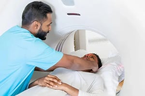 CT Tech preparing patient for CT scan