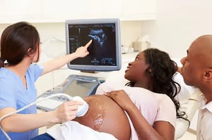 Ultrasound Tech performing an ultrasound on a patient