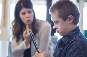 An SLP working with a child with special needs.