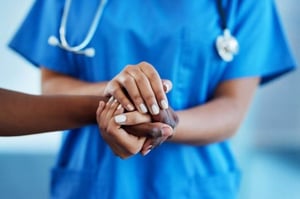 healthcare workers holding hands