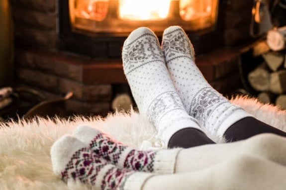feet up by fireplace