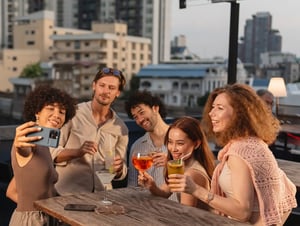 Friends drinking at a rooftop bar in Kansas City, MO