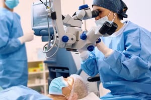 Ophthalmic Medical Technologist doing eye surgery on patient