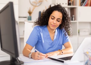 healthcare worker making a list