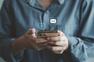 up close picture of a person subscribing to newsletter on their iPhone