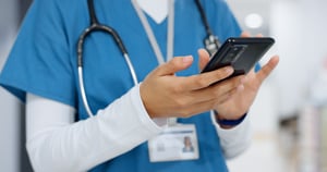 healthcare worker on mobile phone