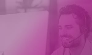 male recruiter with headset on a pink gradient background