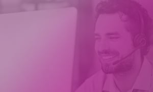 male recruiter with headset on a pink gradient background