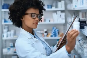 pharmacist stocking the shelves of the pharmacy